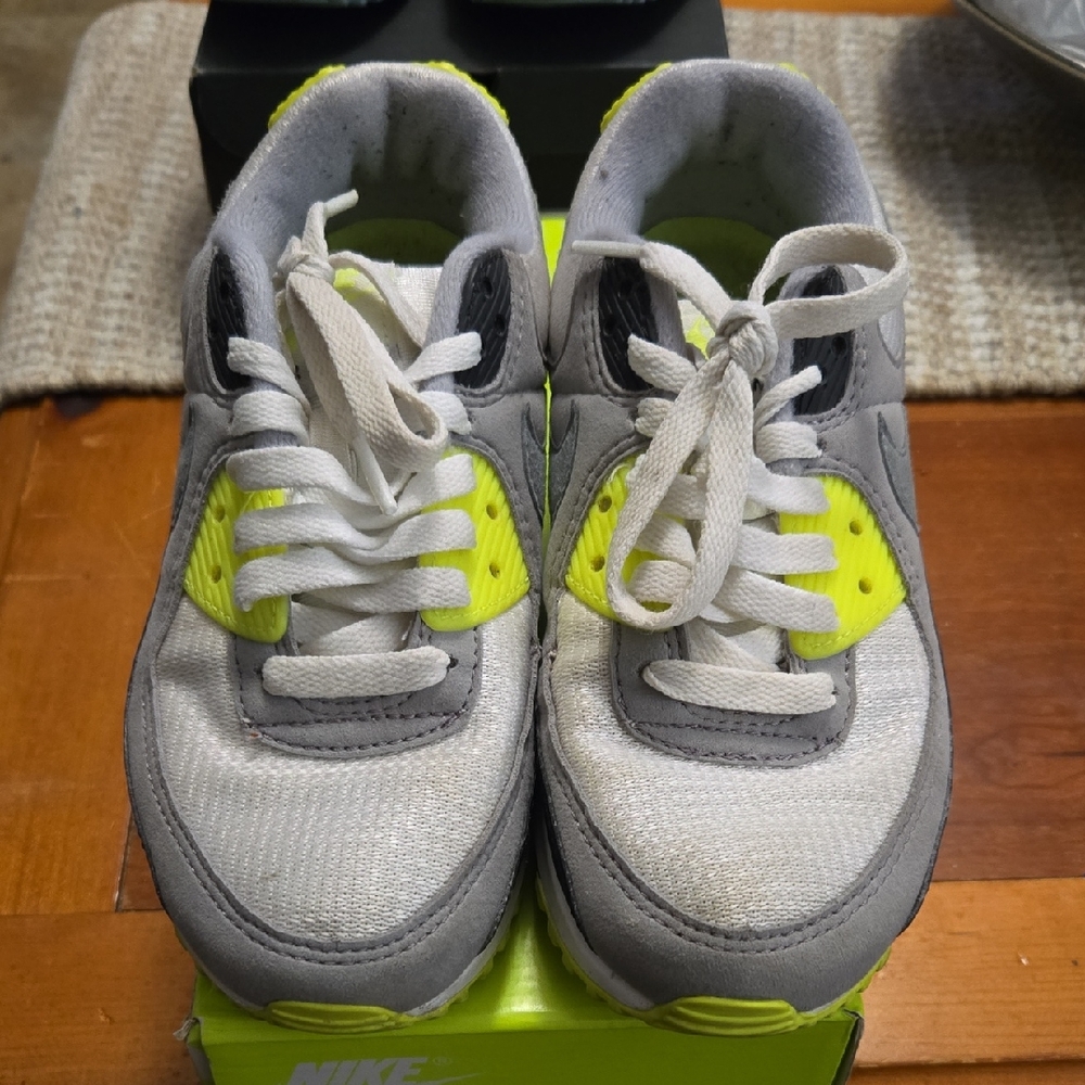 Nike Air Max 90 sneaker. White, black, gray, with neon yellow accents